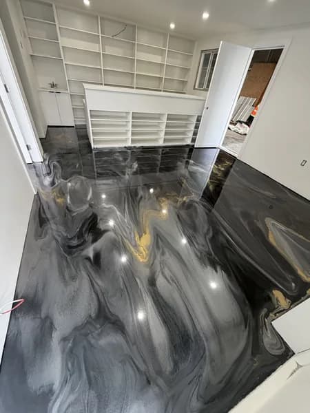 Grey metallic epoxy coating on a polished concrete floor