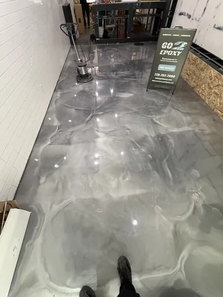 Metallic epoxy garage floor with gold veining and high-gloss topcoat