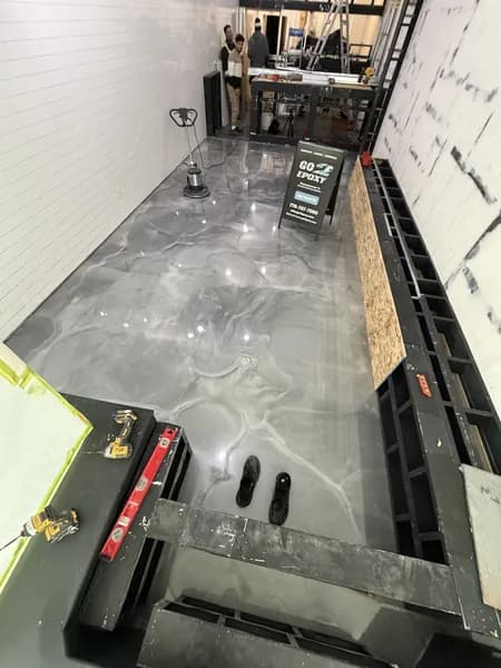 Metallic epoxy floor with charcoal and silver swirl finish