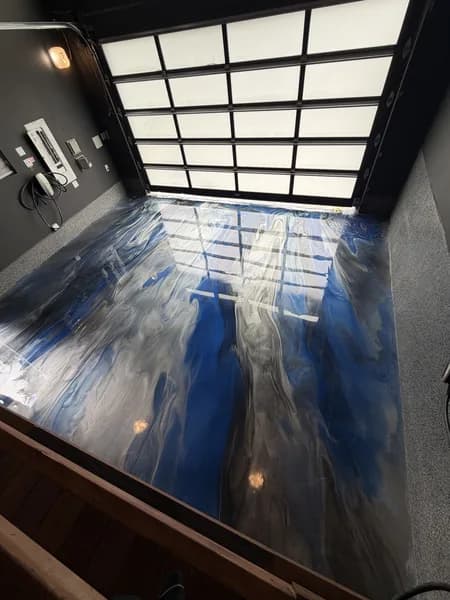 High-gloss metallic epoxy garage floor with blue and grey swirl finish in South Surrey