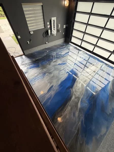 Metallic epoxy garage floor with white and grey colour movement in South Surrey