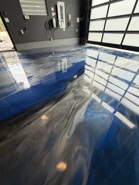 Metallic epoxy garage floor with blue-white-grey liquid marble effect in South Surrey