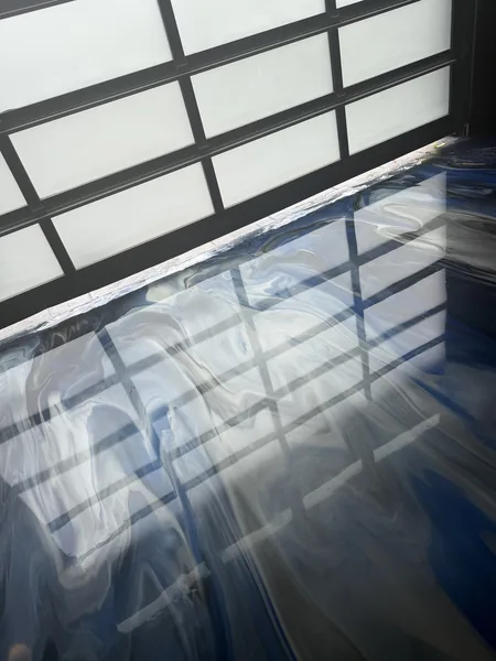 Blue and grey metallic epoxy garage floor with mirror-like finish in South Surrey