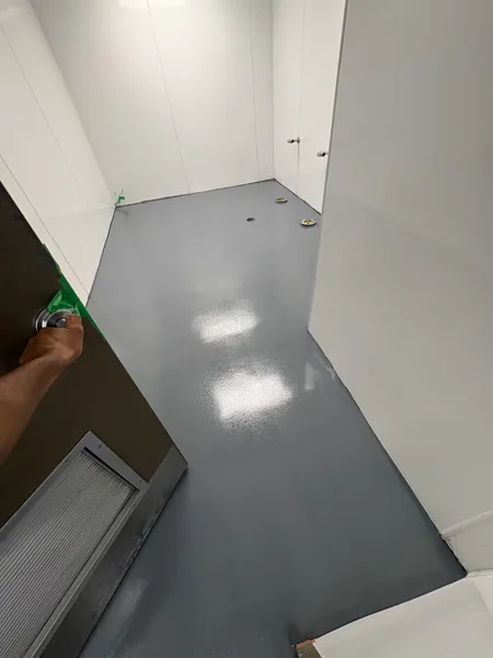 Grey solid epoxy floor in a commercial washroom in Coquitlam, BC