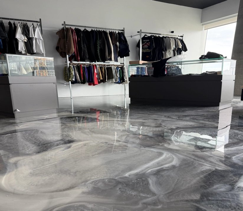 Silver metallic epoxy floor installed in a Richmond, BC clothing store